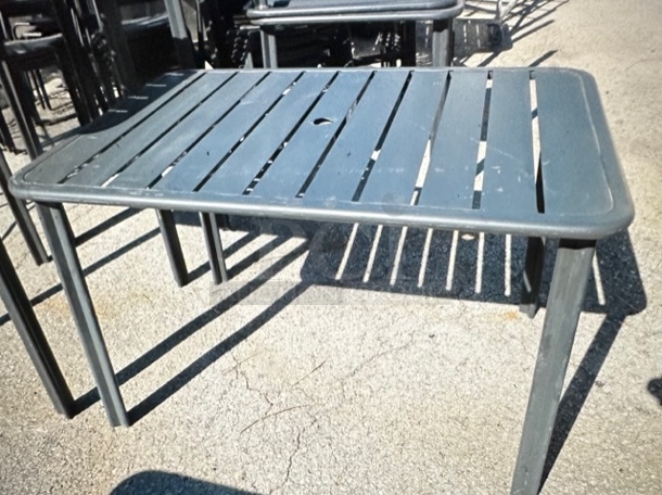 One Brown Aluminum Patio table. 48X32X29