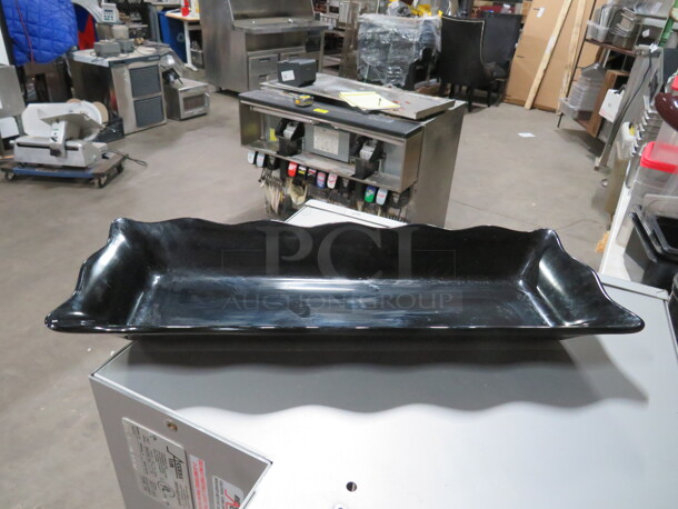 One GET 17X6.5 Black Melamine Platter. #ML87. $24.75 - Image 1 of 1