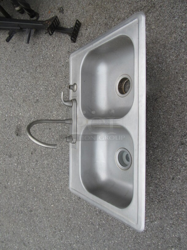 One Stainless Steel Double Sink With Faucet. 33X22X10