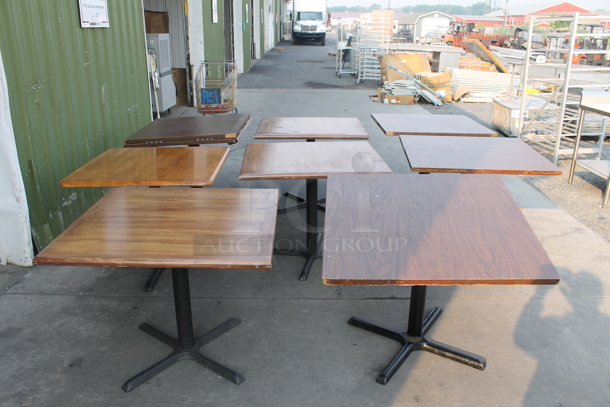 8 Square Wood Style Tables With Black X-Prong Table Base. 8 Times Your Bid! Cosmetic Condition May Vary. - Image 1 of 3