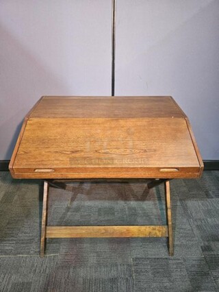 Antique wooden secretary style desk. Is two separate pieces. Bottom half folds out with a metal chain and the top part sits on. Nothing broken, in good condition. Could be cleaned up nicely to make a beautiful antique addition to any space! 36"H x 38"W x 27"D. 
