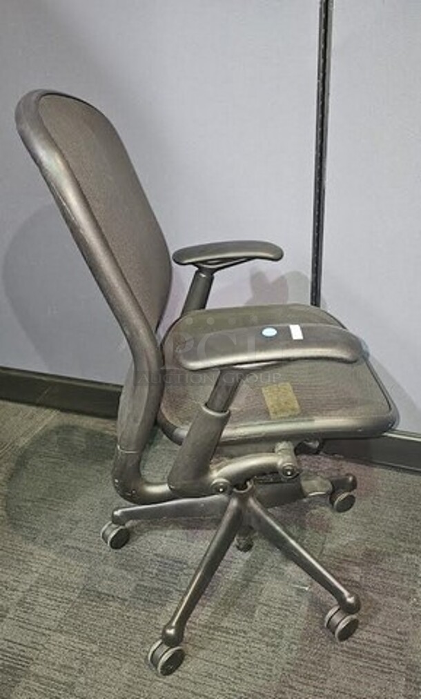 Black office/ desk chair made by Knoll. Features breathable fabric, armrests and has a black metal frame on wheels. In good used condition with signs of use and some scratches but a great chair from a well-known brand. Measures 40” H x 26.5” W. 

 - Image 2 of 3