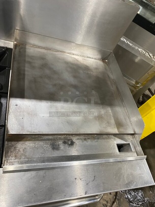 Patriot Commercial Natural Gas Powered 6 Burner Stove With Flat Griddle! Flat Griddle Has Side Splashes! With Raised Back Splash! With 2 Oven Underneath! Metal Oven Racks! All Stainless Steel! On Casters! Model: FMGR6024GNG SN: 17035100006 - Image 7 of 12