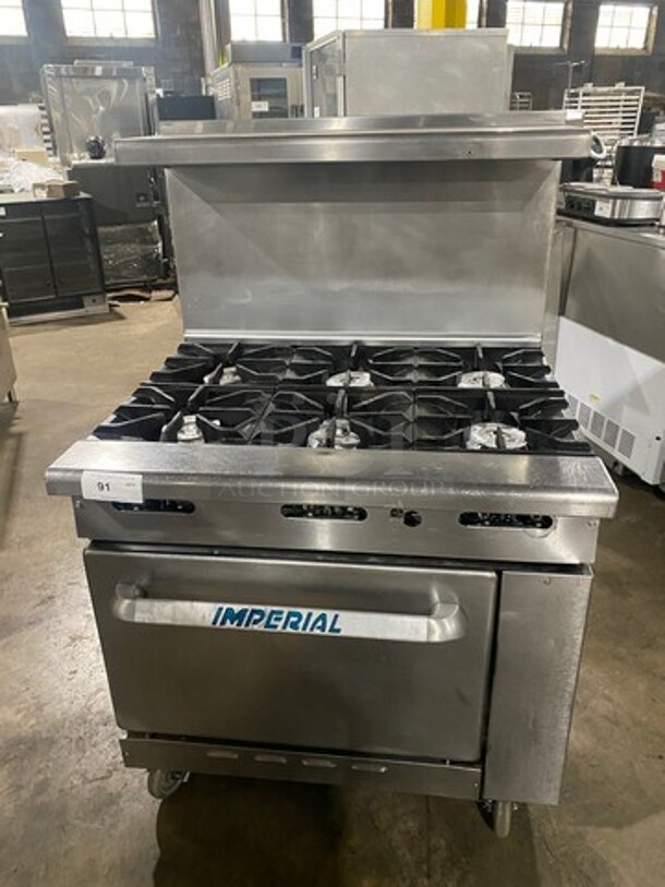 Imperial Commercial Natural Gas Powered 6 Burner Stove! With Raised Back Splash And Salamander Shelf! With Oven Underneath! All Stainless Steel! On Casters! - Image 1 of 8