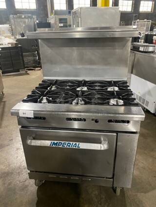 Imperial Commercial Natural Gas Powered 6 Burner Stove! With Raised Back Splash And Salamander Shelf! With Oven Underneath! All Stainless Steel! On Casters!