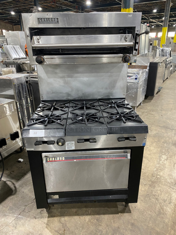 WOW! Garland Commercial Natural Gas Powered 6 Burner Stove! With Oven Underneath! Metal Oven Racks! With Raised Backsplash! With Salamander! All Stainless Steel! On Legs!