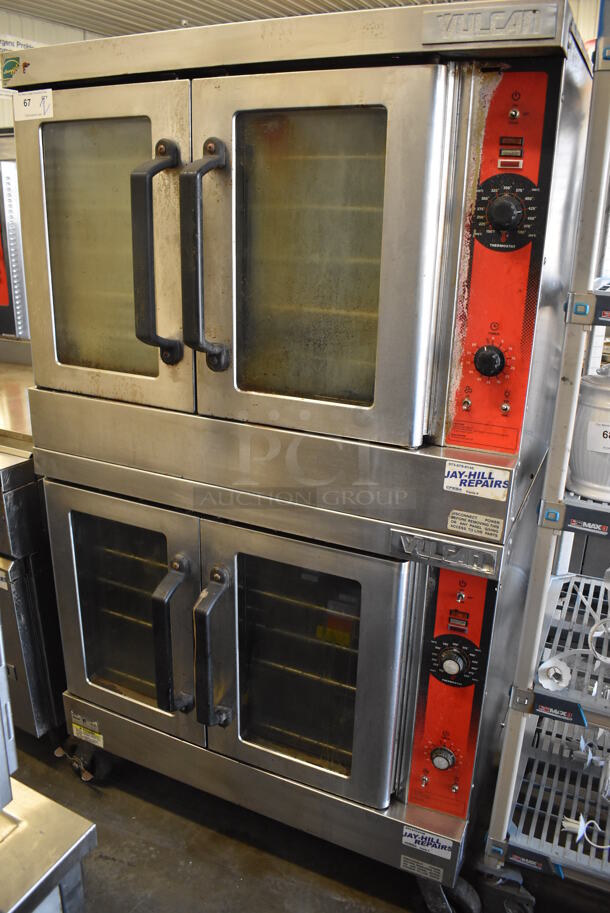 2 Vulcan Stainless Steel Commercial Natural Gas Powered Full Size Convection Oven w/ View Through Doors, Metal Oven Racks and Thermostatic Controls on Commercial Casters. 40x34x70. 2 Times Your Bid!