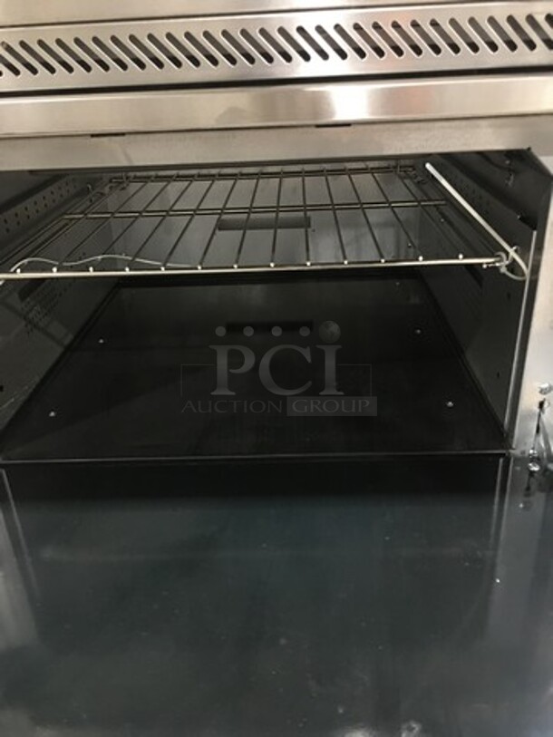 AMAZING FIND! NEW! Vulcan Commercial Electric Powered French Top/ Hot Plate Stove! With Raised Back Splash And Salamander Shelf! With Oven Underneath! All Stainless Steel! On Legs! Model: EV48S4HT208 SN: 481880485 208V 60HZ 1/3 Phase - Image 5 of 12