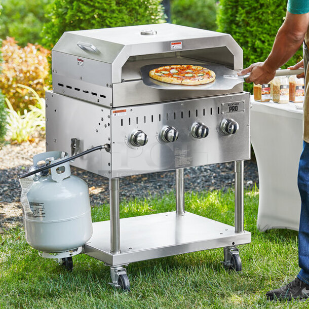 LIKE NEW! 2022 Backyard Pro 554LPG36 Stainless Steel Commercial Propane Gas Powered Outdoor Grill w/ Brick Oven Attachment and Under Shelf on Commercial Casters. Stock Picture Used as Gallery. Tested and Working! - Image 1 of 10
