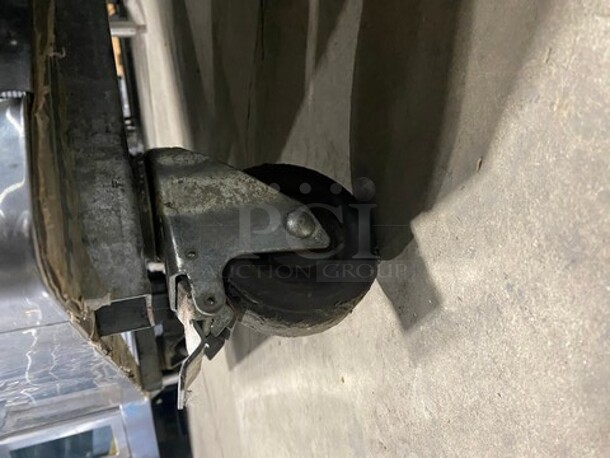 Bison Stainless Steel Commercial 2 Door Reach In Cooler! With Poly Coated Racks! On Commercial Casters!  - Image 7 of 8