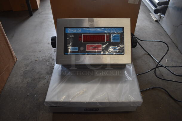 BRAND NEW IN BOX! Doran Model 7000XLM Stainless Steel Commercial Scale. 12x6.5x3, 13x12x4