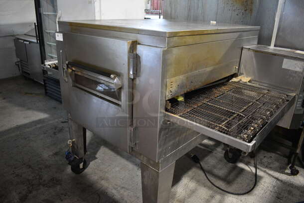 Lincoln Impinger 1040 Stainless Steel Commercial Natural Gas Powered Single Deck Conveyor Pizza Oven on Commercial Casters. 82x53x53