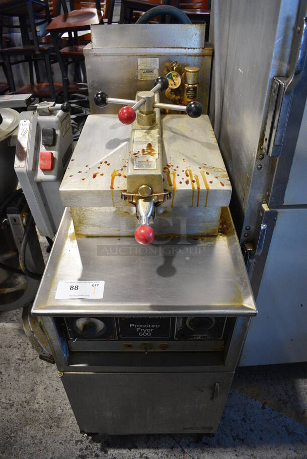 Henny Penny Model 600RB Stainless Steel Commercial Floor Style Propane Gas Powered Pressure Fryer on Commercial Casters. 80,000 BTU. 18x40.5x48