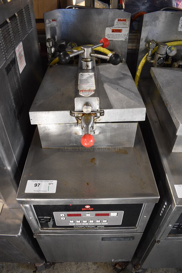 2016 Henny Penny 600C Stainless Steel Commercial Floor Style Natural Gas Powered Pressure Fryer on Commercial Casters. 80,000 BTU. 18x39x48