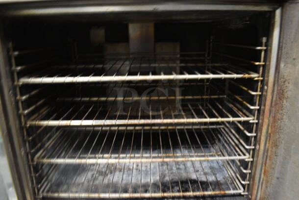 Imperial Stainless Steel Commercial Gas Powered Full Size Convection Oven w/ View Through Door, Solid Door, Metal Oven Racks and Thermostatic Controls on Metal Legs. 36x41x61. BUYER MUST REMOVE. Item Was in Working Condition on Last Day of Business. (kitchen) - Image 4 of 6