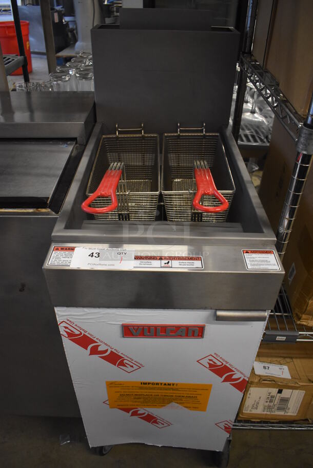 BRAND NEW! 2016 Vulcan LG300-1 Stainless Steel Commercial Floor Style Natural Gas Powered Deep Fat Fryer w/ 2 Metal Fry Baskets on Commercial Casters. 90,000 BTU. 15.5x30x47 - Image 1 of 6