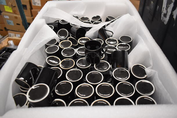 ALL ONE MONEY! Bin of Black Ceramic Mugs. 2.75x2x2 - Image 2 of 3
