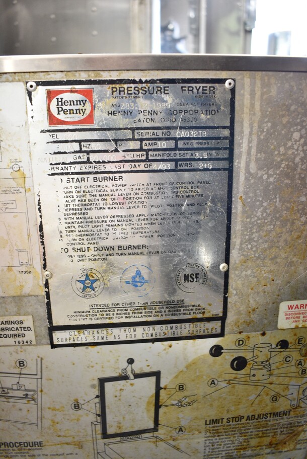 Henny Penny 600 Stainless Steel Commercial Floor Style Natural Gas Powered Pressure Fryer w/ Metal Fry Basket on Commercial Casters. 80,000 BTU.  - Image 10 of 10