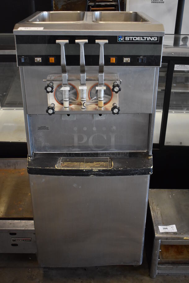 Stoelting 4231-18B Stainless Steel Commercial Floor Style 2 Flavor w/ Twist Soft Serve Ice Cream Machine on Commercial Casters. 208-230 volts, 1 Phase. 26x31x60