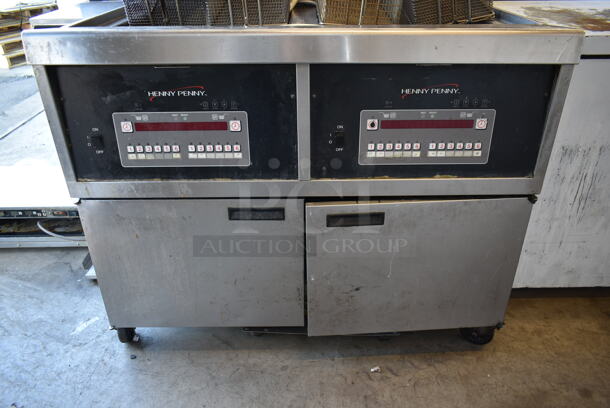 2015 Henny Penny OFG-342 Stainless Steel Commercial Floor Style Natural Gas Powered 2 Bay Deep Fat Fryer w/ Filtration System on Commercial Casters. 240,000 BTU.  - Image 6 of 11