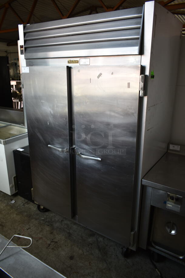 Traulsen G20010 ENERGY STAR Stainless Steel Commercial 2 Door Reach In Cooler w/ Poly Coated Racks on Commercial Casters. 115 Volts, 1 Phase. Tested and Powers On But Does Not Get Cold - Image 1 of 7
