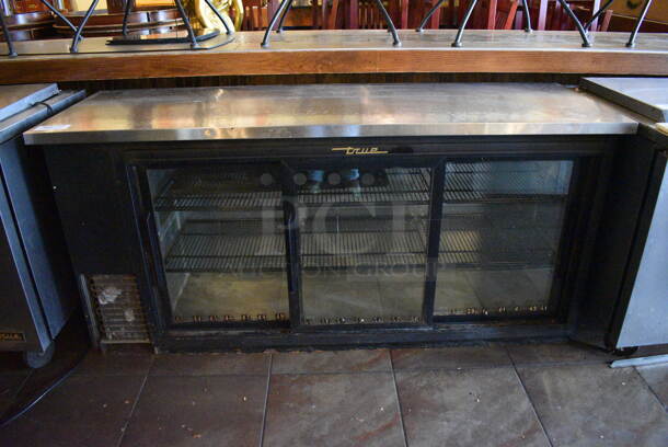 2013 True TBB-24-72G-SD Metal Commercial 3 Door Back Bar Cooler Merchandiser. BUYER MUST REMOVE. 115 Volts, 1 Phase. 73x24.5x36. Item Was in Working Condition on Last Day of Business. (Susquehanna Ale House) - Image 1 of 7