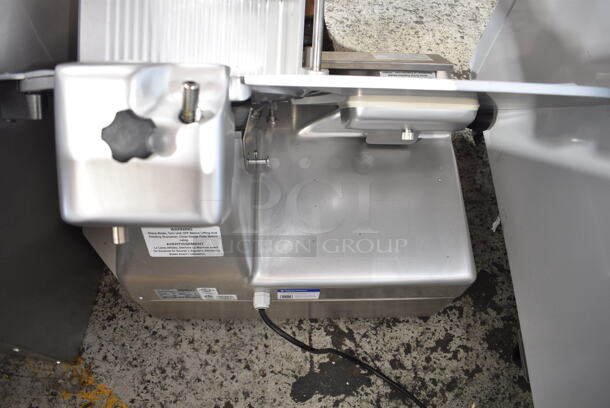 BRAND NEW SCRATCH AND DENT! Estella 348SLA13 Stainless Steel Commercial Countertop Automatic Meat Slicer w/ Blade Sharpener. 120 Volts, 1 Phase. Tested and Powers On But Parts Do Not Move
 - Image 7 of 8