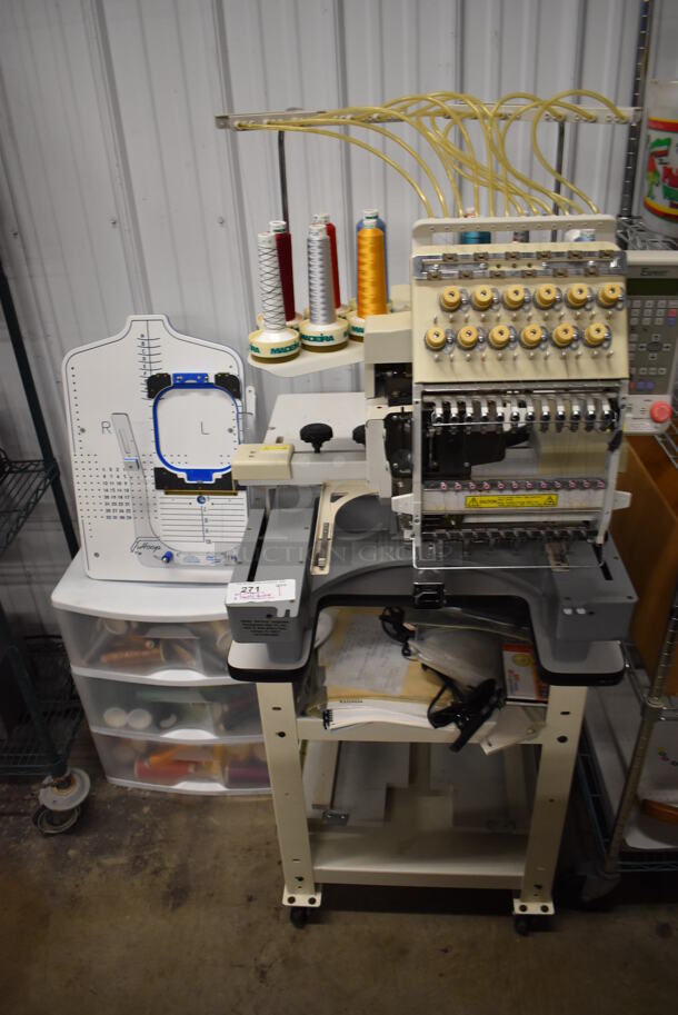 Expert Metal Commercial Floor Style Embroidery Machine on Commercial Casters w/ 2 Tiers Worth of Extra Parts, White 3 Drawer Cabinet of Thread and Pattern Board. Includes 25x34x64 - Image 1 of 12