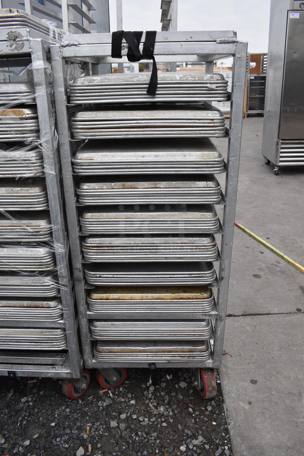 Metal Commercial Pan Transport Rack on Commercial Casters w/ 58 Metal Full Size Baking Pans. 21x26x52. 18x26x1 - Image 1 of 4