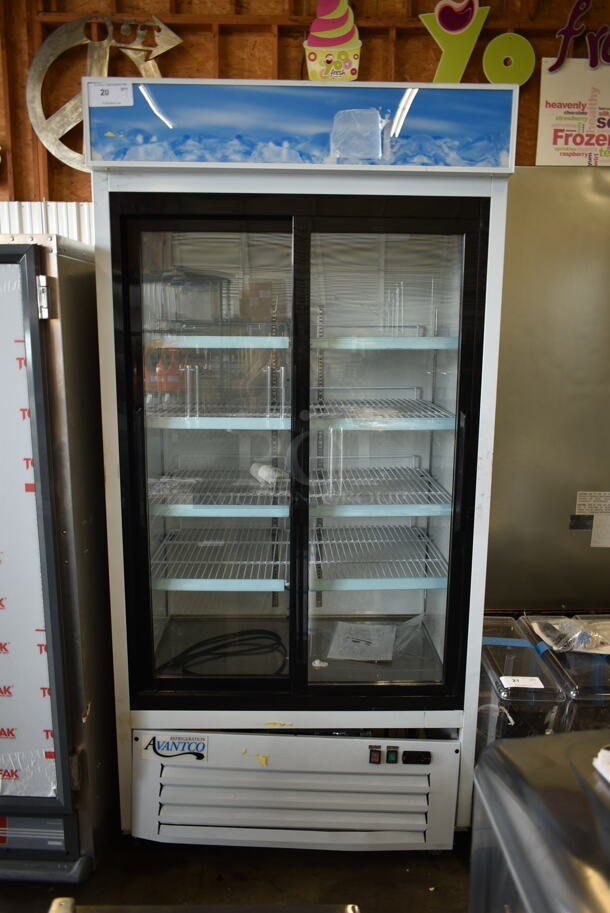 BRAND NEW SCRATCH AND DENT! 2023 Avantco 178GDS33HCW Metal Commercial 2 Door Reach In Cooler Merchandiser w/ Poly Coated Racks on Commercial Casters. 115 Volts, 1 Phase. Cannot Test Due To Cut Power Cord