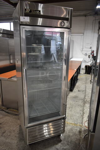 True T-23FG Stainless Steel Commercial Single Door Reach In Cooler Merchandiser w/ Poly Coated Racks on Commercial Casters. 115 Volts, 1 Phase. Tested and Powers On But Does Not Get Cold