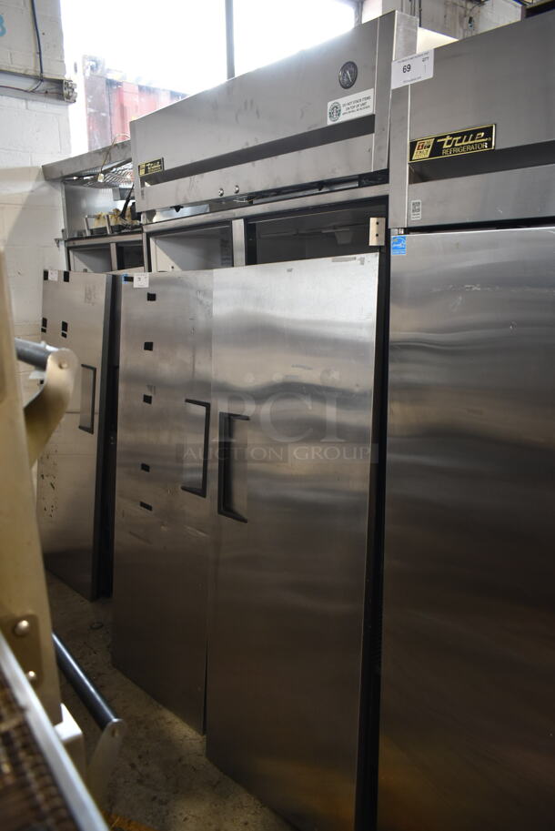 2012 True TG2R-2S ENERGY STAR Stainless Steel Commercial 2 Door Reach In Cooler w/ Poly Coated Racks on Commercial Casters. Doors Need To Be Reattached. 115 Volts, 1 Phase. Tested and Working! - Image 1 of 8