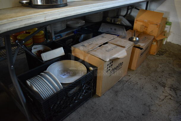 ALL ONE MONEY! Lot of Various Items Including Dishes, Lightbulbs and Utensils. Does Not Include Table.