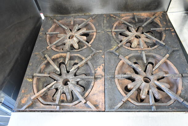 Garland M44R Stainless Steel Commercial Natural Gas Powered 4 Burner Range w/ Oven, Over Shelf and Back Splash on Commercial Casters.  - Image 3 of 9