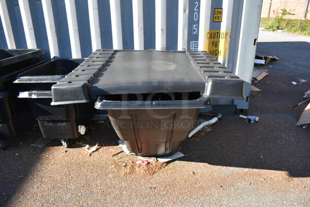 BRAND NEW SCRATCH AND DENT! Rubbermaid Black Poly Bin w/ Lid on Commercial Casters.  - Image 2 of 4