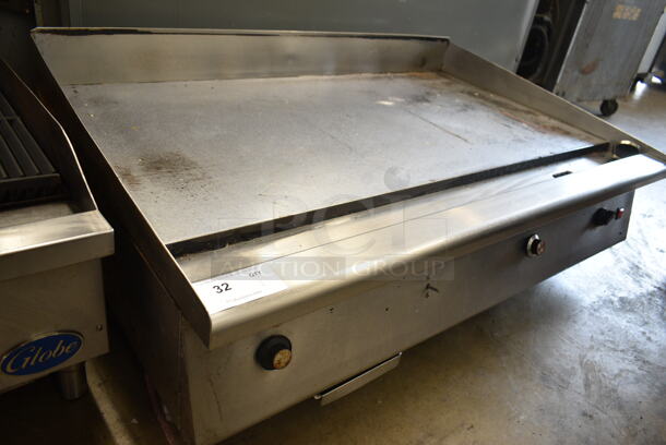 54400547 Stainless Steel Commercial Countertop Natural Gas Powered Flat Top Griddle.  - Image 1 of 7