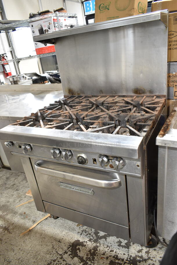Southbend 4361D Stainless Steel Commercial Natural Gas Powered 6 Burner Range w/ Oven, Over Shelf and Back Splash on Commercial Casters.  - Image 1 of 5