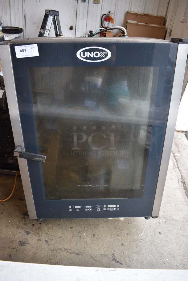 Unox Cadco Model XAV805P-208 Stainless Steel Commercial Electric Powered Convection Oven. Missing 1 Leg. 208 Volts, 3 Phase. 34x34x49