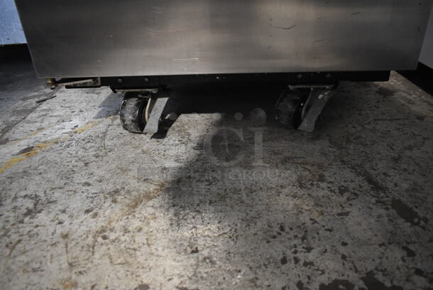 2015 True TG1R-1S ENERGY STAR Stainless Steel Commercial Single Door Reach In Cooler w/ Poly Coated Racks on Commercial Casters. 115 Volts, 1 Phase. Tested and Working! - Image 4 of 7