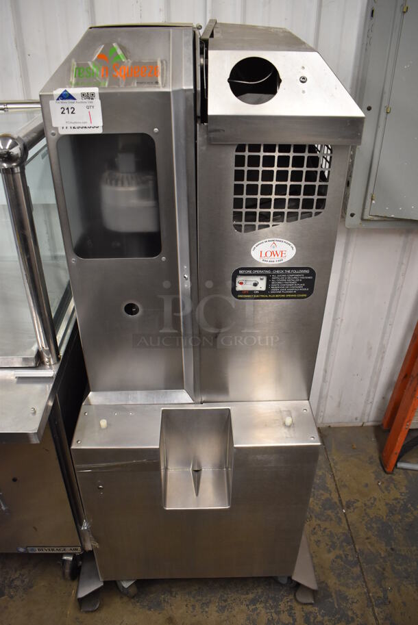 Fresh N Squeeze Stainless Steel Commercial Floor Style Automatic Citrus Juicer on Commercial Casters. 32x33x67. Tested and Does Not Power On - Image 1 of 6