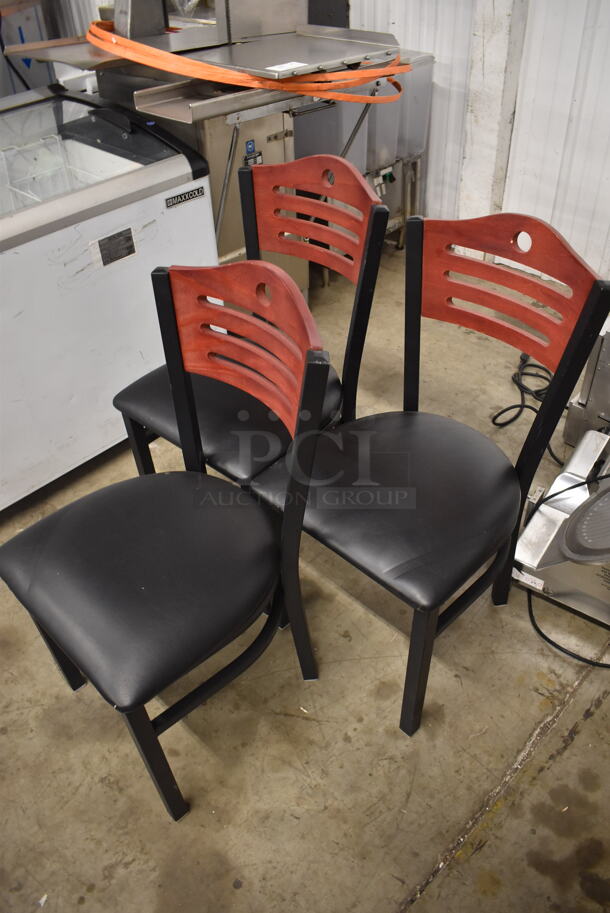 3 Black Cushioned Chairs With Wood Style Ladder Backs on Black Legs. 3 Times Your Bid! Cosmetic Condition May Vary.  - Image 3 of 3