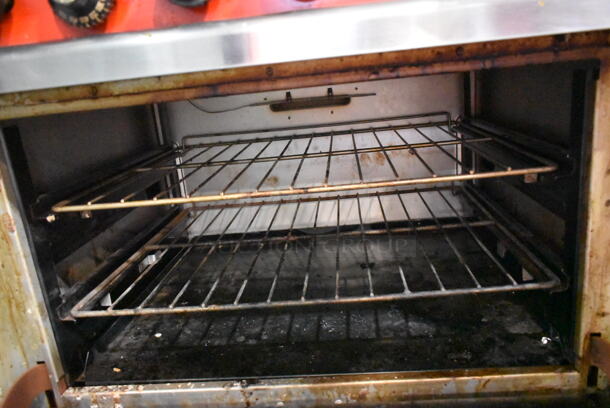 Vulcan 36L-572 Stainless Steel Commercial Propane Gas Powered 6 Burner Range w/ Oven, Over Shelf and Back Splash on Commercial Casters.  - Image 4 of 6
