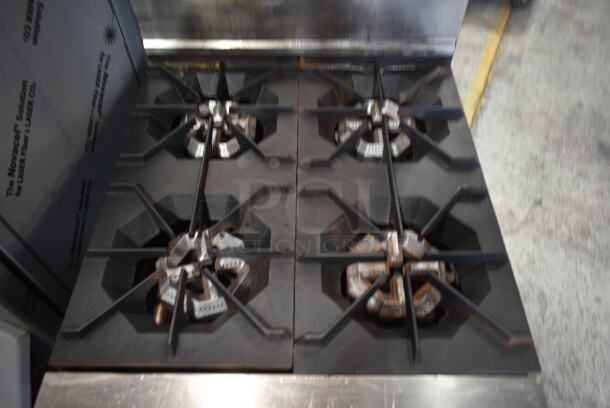 Dynamic Cooking Systems DCS Stainless Steel Commercial Gas Powered 4 Burner Range w/ Oven, Back Splash and Removable Cutting Board.  - Image 4 of 7