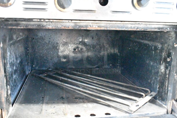 Garland M44T Stainless Steel Commercial Natural Gas Powered Flat Top w/ Oven, Salamander Cheese Melter and Back Splash on Commercial Casters. - Image 8 of 12