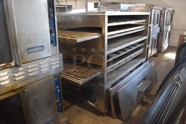 XLT Commercial Stainless Steel Natural Gas Powerd Double Stack Conveyor Oven on Commercial Casters. Door Needs To Be Reattached. 115V