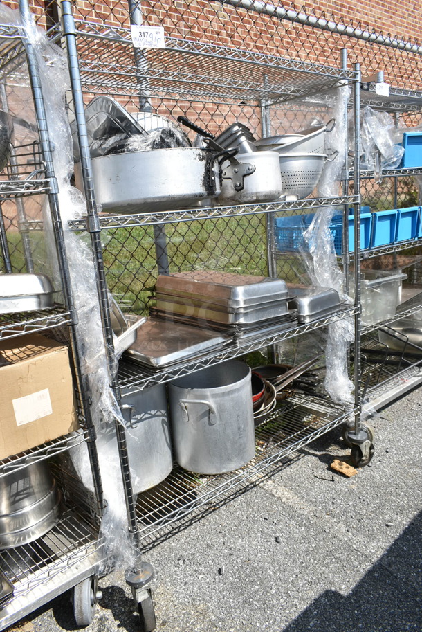 Chrome Finish 4 Tier Shelving Unit w/ Contents Including Stainless Steel Drop In Bins, Colander, Stock Pots. BUYER MUST DISMANTLE. PCI CANNOT DISMANTLE FOR SHIPPING. PLEASE CONSIDER FREIGHT CHARGES.  - Image 1 of 11