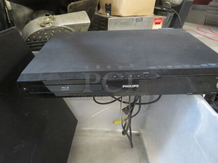 One Phillips DVD Player With Speakers. 