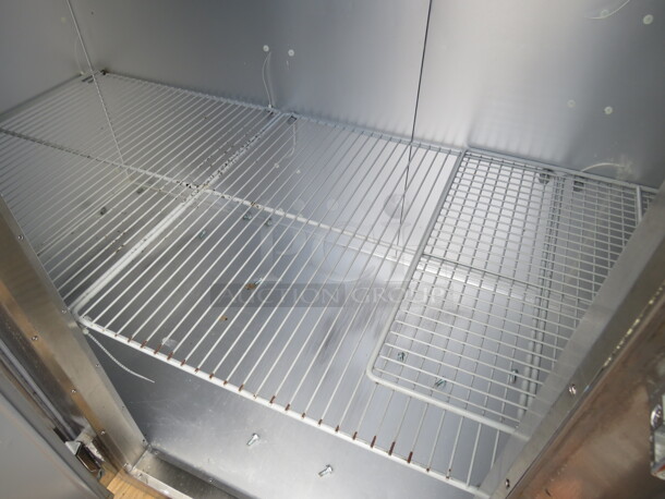 One WORKING 3 Door Stainless Steel Traulsen Refrigerator With 9 Racks, On Casters. 115 Volt. Model# G30011. 77X35X83.5. $9176.00. - Image 2 of 6