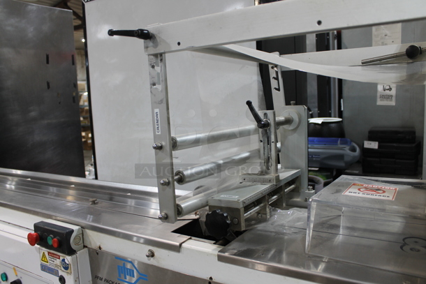 PFM Packaging 30 M Metal Commercial Floor Style Horizontal Form Fill and Seal / Horizontal Flow Wrapper Machine on Commercial Casters. 220 Volts, 1 Phase.  - Image 5 of 11