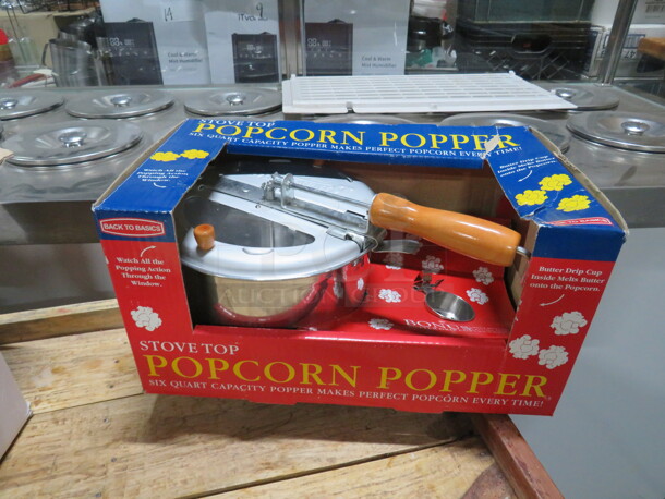 One NEW Stovetop Popcorn Popper. 